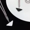 2021 Femmes Hommes Collier Chaîne Bijoux De Mode Noir Et Blanc Triangle Pendentif Design Party Argent Hip Hop Punk Hommes Collier Party2838532