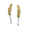 boucles d'oreilles en plumes vintage