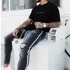 Trendy Männer Skinny Jean Biker Destroyed Frayed Fit Denim Zerrissene Hosen Seitenstreifen Bleistift Hose Hip Hop Streetwear 210723