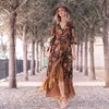 Yaz baskılı retro elbise kadın uzun kollu düzensiz büyük etek bohemi tarzı fırfırlı rahat elbiseler
