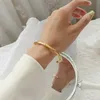 2021 New Ladies French Style Bamboo Open Bracelet Design Sense Titanium Steel Golden Light Luxury Jewelry Does Not Fade Q0717