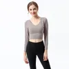 Tuta da donna Top T-shirt Abbigliamento da donna Abbigliamento da yoga Fitness Sport Bellezza Indietro Reggiseno elasticizzato a maniche lunghe ad asciugatura rapida Biancheria intima T-shirt antiurto