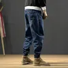 Män jeans japansk stil mode män löst passar skarvad designer last byxor hombre harem streetwear hip hop joggers297f