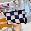 Sturdy special material woven wrist bag High-quality black and white checkered color matching trendy shopping bags Unisex style Ny2395