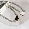 2021 womens mens Luxury designer Necklace chain fashion jewelry black and white triangle pendant design party silver hip hop punk 240Z