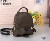 Echtes Leder Mini Herren Damen Outdoor Sport Rucksack Umhängetaschen Totes Handtasche Cross Body Kosmetiktasche Handytasche Geldbörsen Geldbörsen L610