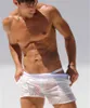 Pantalones de verano Sexy ver a través de pantalones cortos transparentes para hombres Casual Color blanco playa sin forro para hombre