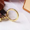 M69854 Mode Designer Keychain Poupée à la main Poupée de voiture Porte-clés Femme Sac Charme Accessoires de décoration suspendue Accessoires