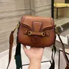 1955 أكياس السرج حقيبة كتف أزياء النساء CrossBody حقيبة يد جودة luxurys كبار المصممين مخلب سيدة محفظة حقائب يد معدنية جلد طبيعي أبازيم طباعة