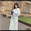 Trench Manteaux d'extérieur Manteaux Vêtements pour femmes Vêtements Drop Livraison 2021 Dames Blanc Stitch Stripe Long Slim Costume Col Double Boutonnage Cravate Dentelle