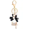 Keychains Pearl Alloy Metal Handbag Key Chain Fashion Ring Pom Gifts for Women Girls Bag Charm Keychain Pendant Jewelry