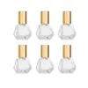 8 ml glasrulleflaska för eteriska oljor, mini glasflaskor med rostfria rullebollar, guld aluminium kepsar rullar injektionsflaskig aromaterapi parfymbehållare