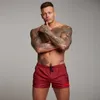 Haute qualité séchage rapide hommes Shorts été plage mode poche fermeture éclair musculation Fitness pantalons courts gymnases survêtement Shorts 210421