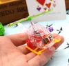 Piccolo aereo trasparente a orologeria Rifornimenti del partito elicottero di plastica che rulla con il commercio all'ingrosso del giocattolo girevole dell'elica