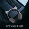 Nouveaux étudiants oreilles de chat mignonnes portant un casque de jeu Bluetooth de dessin animé sans fil explosion de téléphone portable casque e-sports