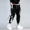 Męskie spodnie męskie czarne bojówki na joggery spodnie dresowe męskie białe koreańskie Techwear Steetwear hip-hopowe wstążki