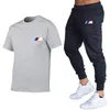 Designer 2021New Mens Survêtement Deux Pièces Ensembles Manches Courtes Et Pantalon Avec Des Lettres À Rayures Style De Mode Printemps Été Outwear Ensemble De Sport Tshirt Costume