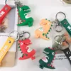 Ciondolo per borsa portachiavi per auto con bambola di dinosauro cartone animato Cinghie per ciondolo in PVC per uomo e donna Portachiavi con ciondoli tridimensionali 4 colori