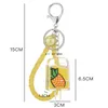 Frukt glass olja vätska nyckelring nyckelring par bil handväska hänger för kvinnor student mode smycken kommer och sandiga