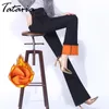 タタリア冬の暖かいジーンズの女性の厚いウエストの弾性デニムのズボンフレアパンツ210514のためのフリースの細いハレム