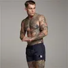 Męskie siłownie Fitness Kulturystyka Szorty Moda Trend Letni List Dorywczo Fajne Krótkie spodnie Designer Mężczyzna Jogger Workout Plaża Breechcloth M-3x