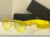 Zonnebril Voor Mannen en Vrouwen Zomer stijl 2232 Anti-Ultraviolet Retro Plaat Ovale frameloze mode Brillen Willekeurige Doos