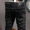 Koreański styl moda mężczyźni dżinsy Ly projektant elastyczne slim fit Ripped casual drelich spodnie ołówek vintage proste spodnie