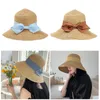 Portable Classic Bowknot Women Sun Hat Big Wide Brim Anti-UV Utomhus Travel Beach Cap Foldbara Sommar Halm Bucket Viselser Mössor