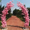 Decorazione di nozze romantica Porta ad arco in fiore di ciliegio Strada Piombo Archi a forma di luna Scaffale con set di fiori artificiali per forniture per fondali per feste