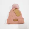 Designer päls pom poms barn hat mode vinter hattar för barn kepsar baby solid färg stickad mössa keps