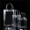 선물 포장 10pcs / 20pcs / lot 투명한 부드러운 PVC 토트 포장 가방 손으로 루프, 투명 플라스틱 핸드백, 화장품 가방