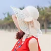 Cappelli di paglia alla moda con fiocco Cappelli pieghevoli a tesa larga Cappelli di protezione solare da spiaggia