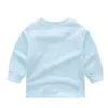 T-shirt en coton pour enfants, de haute qualité, à la mode, décontracté, pour garçons et filles, chemise à bascule, col rond, manches longues, hauts blancs, printemps 2022