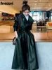 Vår svart överdimensionerade långa vattentäta lädergravrockar för kvinnor långärmad lös koreanska modekläder