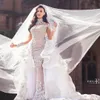Robe de mariée en cristal de strass luxueux Perles à couilles appliques à manches longues Sirène Robe de mariée magnifique Dubaï Robe de mariée Dubai Doublerker