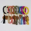Personalizzato di alta qualità colorato perline di legno da polso elasticizzato disco portachiavi personalizzato nappa cinturino braccialetto portachiavi