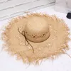 Grand chapeau de paille de paille de raffie bordée Femmes Sandales d'été Beach chapeaux All-match Crème solaire large