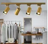 Lampy wiszące nordycka złota jasna dekoracja plamka światła salon jadalnia domowa rurka szatnia odzież sklep LED Track