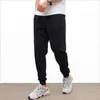 Męskie dresowe dresy prowadzące męskie sportowe odzież fitness oddychająca oddychająca odzież Homme Casual Cotton Spodni Owwony W220307