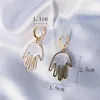 Hoop huggie söta små örhängen för kvinnor män ihåliga hand hänge guld färg smycken pendientes ms209