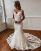 Marfim sereia vestidos de casamento lace apliques vestidos nupciais v pescoço ver através de botões cobertos de volta varredura de trem robe de mariée