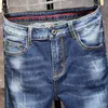 Spring and Lato Męskie Ripped Jeans Trendy Marka Młodzież Rozciąganie Regularne Dane Dżinsowe Spodnie Męskie Szczupłe Proste Nogi Spodnie 210531