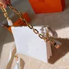 2021 المرأة الفضة crossbody سلسلة أكياس فاخرة محافظ صغيرة اليد مصممي الكتف رسول حقيبة جودة عالية مع الزهور تنقش سعة كبيرة L21040601