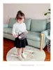 Designer barn handväskor mode baby flickor houndstooth woolen midja väska barn plysch får hänge en axelväskor mini plånbok f952