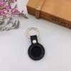 Designers Brown Flower Cas pour les aéragles de pomme Locator Tracker Dispositif antilost Luxurys PU Couver de protection en cuir Metal Ring Key93284633