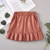 Filles jupes courtes en cuir enfants jupe à volants élastique enfant en bas âge bébé bouton poche mini-jupe enfants vêtements solides Vetements Bebe Ropa B2607815