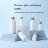 Vorratsflaschen Gläser 10 Stück primäre weiße Glastropfer 10 ml 30 ml 50 ml 100 ml ätherische Ölflasche mit Bambuskappe Kosmetikverpackung