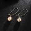 Boucles d'oreilles pendantes en alliage de forme de boule ronde de mode femmes bijoux fins pour le lustre d'usage quotidien