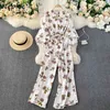 Nelloe Print Bohemian Holiday Jumpsuit Женщины Нерегулярный дизайн Высокая талия Бедра широкая нога Bodysuit V шеи FLARE PLAYPUTION 210423