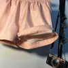春の弾性の高い腰のショートパンツの女性カジュアルストリートウェア明るいシルクミニポケットセクシーなムヤーワイドレッグ夏210722